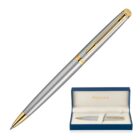 Sleek silver and gold pen with a box. The pen has a smooth metallic finish and gold accents. The box is blue with a soft interior, displaying the pen neatly.