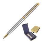 A sleek silver and gold pen with a fine tip, featuring a clip and gold accents. It is angled diagonally. Below, its open box reveals a matching gold and navy design, holding the pen in a secure slot alongside a warranty card.