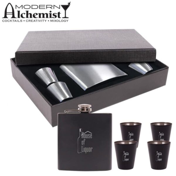 Cocktail set featuring a black flask with House of Liquor text, four black shot glasses, a shaker, and a jigger. The items are displayed in a black box with Modern Alchemist logo on the cover.