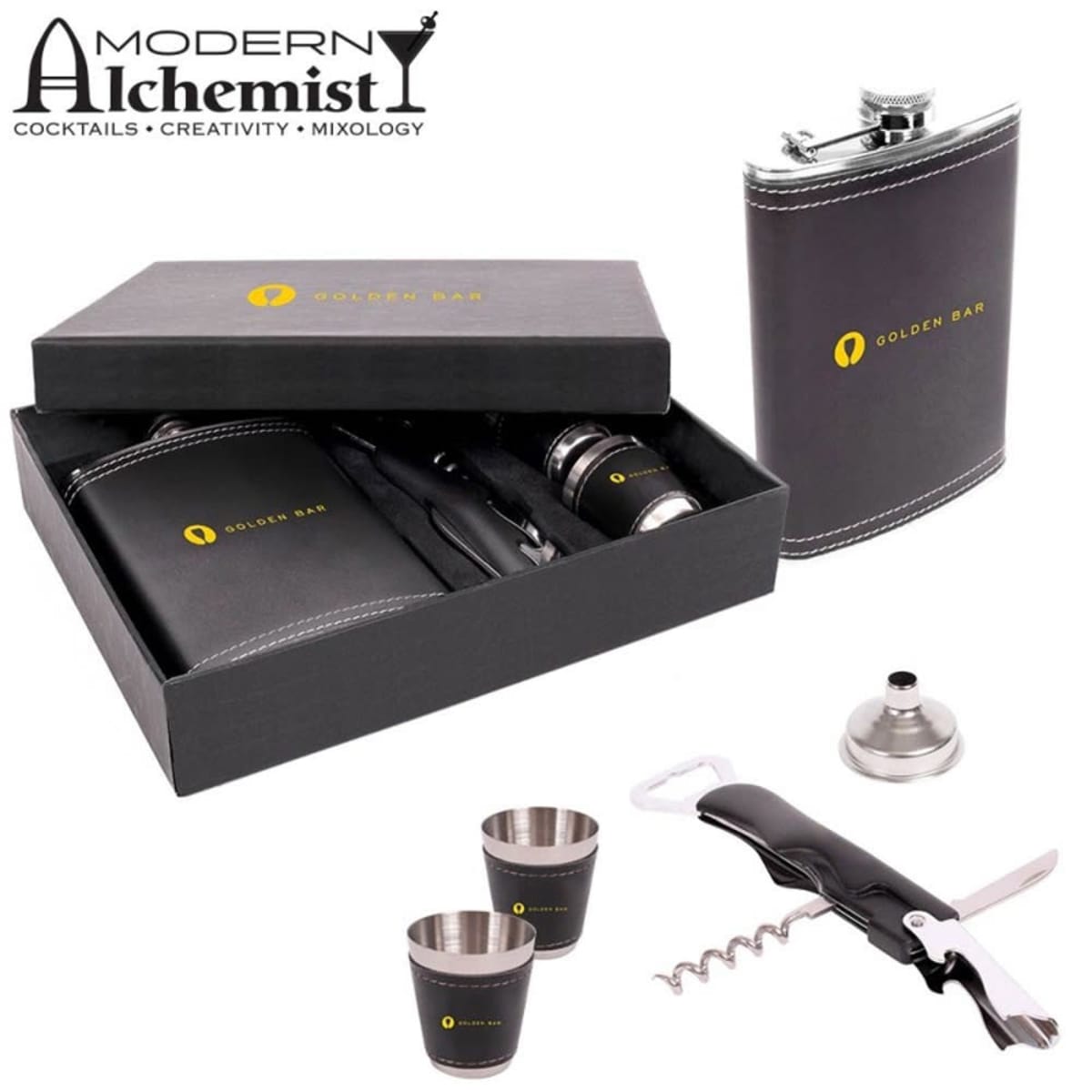 Bartender set with black box displaying Golden Bar logo. Includes a flask, funnel, corkscrew, and two shot cups. Modern Alchemist logo with cocktail elements is visible at the top left. Perfect for mixology and cocktail enthusiasts.