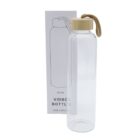 A clear glass bottle with a wooden lid and a rope handle. The bottle is positioned next to its packaging, which features a simple line drawing of the bottle and states a 750ml capacity.