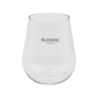 A clear, rounded glass tumbler with the words Belvedere Vodka printed on the side in black and blue letters. The glass has a smooth, simple design and is set against a plain white background.