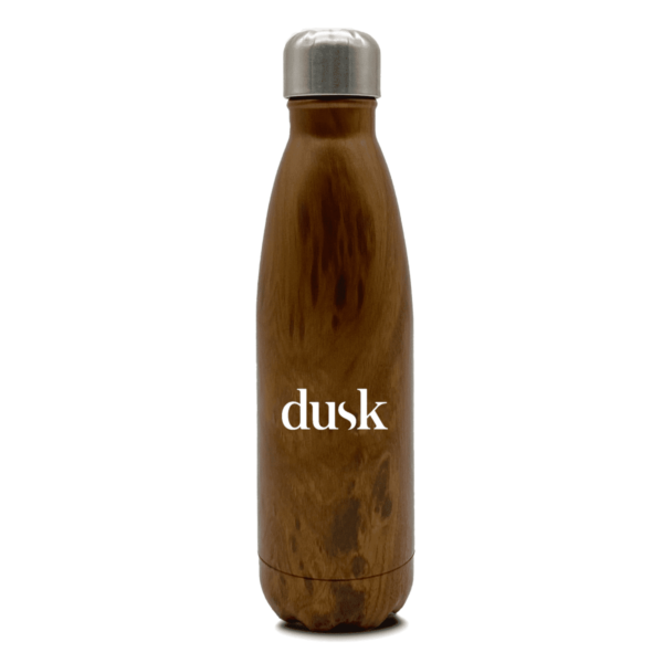 A brown insulated water bottle with a wood-like texture and a silver cap. The word dusk is printed in white on the front.