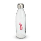 A clear glass bottle with a shiny silver cap. The word Milwaukee is printed in red on the bottle’s front in a script font. The bottle is empty and standing upright against a plain white background.