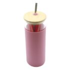 A pink tumbler with a smooth, cylindrical design, featuring a glass top section. It has a bamboo lid with a metal straw inserted through the center, adding a touch of natural elegance to its modern look.