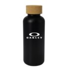 Black water bottle with a cork lid. The white Oakley logo and text are centered on the front.