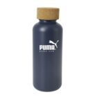 A dark blue bottle with a cork cap featuring the Puma logo and website in white. The bottle has a smooth, matte finish.