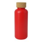 A red, cylindrical bottle with a cork stopper on top. The bottle has a smooth surface and a simple design, with no visible labels or markings.