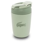 A light green travel mug with a flip-top lid featuring a crocodile logo on the front.