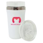 A white travel mug with a clear lid is shown upright, featuring a pink logo resembling a stylized M and the word MUSICMED below it. The lid is detached and placed in front of the mug.