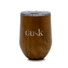 A brown, wood-textured travel tumbler with a clear lid. The word dusk is prominently displayed in white on the side.