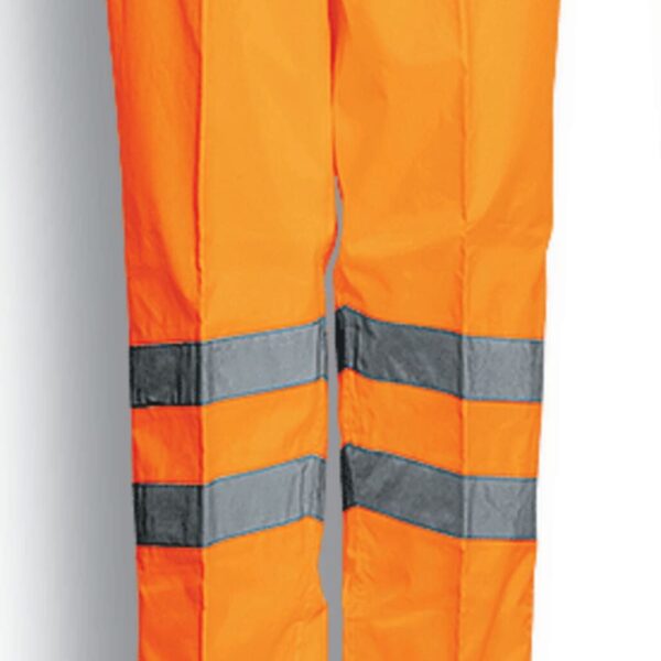 Bright orange safety pants with reflective grey and black stripes near the knees, displayed against a white background. The text Fluro Orange is shown below the pants.