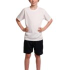A young person with short blonde hair stands smiling, wearing a white T-shirt, black shorts, white socks, and black sneakers. They have their hands on their hips and are standing against a plain white background.