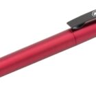 A red ballpoint pen with a sleek metallic finish and black accents. The clip displays the words CARBON COPY in white, along with a triangle logo.