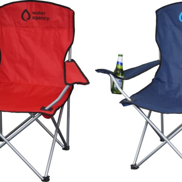Two foldable camping chairs are pictured, one red and one blue, each with water agency logos. Both chairs have a bottle holder containing a drink on the armrest. The chairs have metal frames and fabric seats.