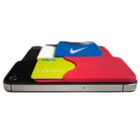 Smartphone lying flat with colorful cardholders attached to its back, showcasing various brand logos, including a swoosh and moji. The cardholders are layered in red, blue, green, and black colors.