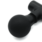 Close-up of a black massage gun with a round attachment on a white background.
