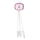 A multi-head charging cable with a pink ribbon symbol on a rectangular case. The cable has multiple connectors, including USB and micro USB, extending from the case. The case has a pink edge with a white face.