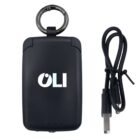 A black portable charger with OLI written on it, featuring a metal keyring on top. A USB charging cable is placed next to the charger, showing both ends of the cable.