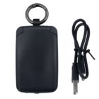 A black portable charging device with a metal keyring attachment is displayed next to a USB charging cable. The charger features four small indicator lights at the bottom.
