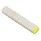 A highlighter pen with a speckled, off-white body and a bright yellow cap, lying on a white surface.