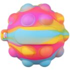 A colorful, round pop-it toy with a handle, featuring a gradient of pink, blue, yellow, and orange. The surface has raised bumps that can be pressed, resembling a silicone sensory toy.