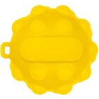 Yellow, round, textured object with raised circular bumps and a rectangular section in the center. It appears to have a small handle or tab on one side.