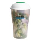 A translucent container filled with salad, featuring mixed greens and sliced onions, is topped with a white lid. The container displays the text Health Hero.