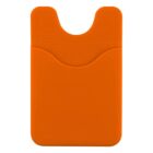 An orange silicone card holder with a curved top and a round cutout at the opening. Its texture is smooth and designed to stick to the back of a phone or similar device.