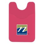 A red silicone card holder with the Nexicom logo, featuring a stylized N in white over a green and blue background. The holder has a curved opening at the top for inserting cards.