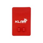 Red cardholder with the word KLAM printed in white, featuring a crown design above the text. The holder has two small protruding hooks or clips on the front.
