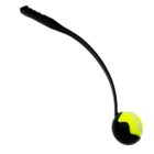 A black, curved dog ball launcher holding a yellow tennis ball.