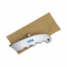 A silver utility knife engraved with the Visa logo lies on top of a brown envelope. The knife has a curved handle with finger grips and a retractable blade.