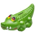 A green rubber toy shaped like a cartoon crocodile with large yellow and red eyes, a smiling mouth, and the word ARBOX printed on its back.
