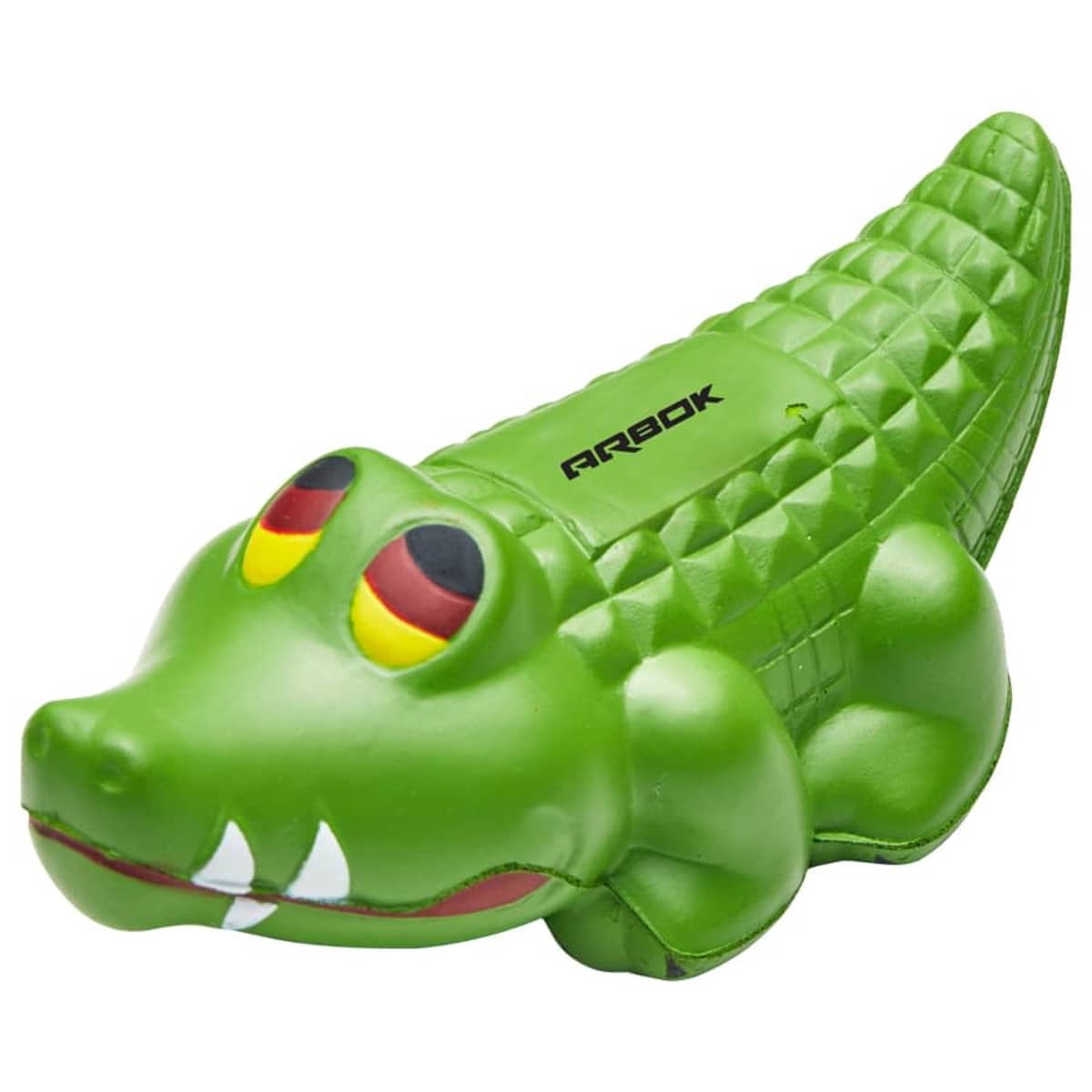 A green crocodile-shaped dog toy with a textured back and cartoonish eyes. The toy has protruding teeth and the word ARBOK on its side.
