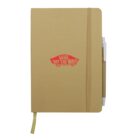 Brown journal with an elastic band and pen holder on the side. The cover features a red Vans Off the Wall logo in the center. A yellow ribbon bookmark is visible at the bottom.