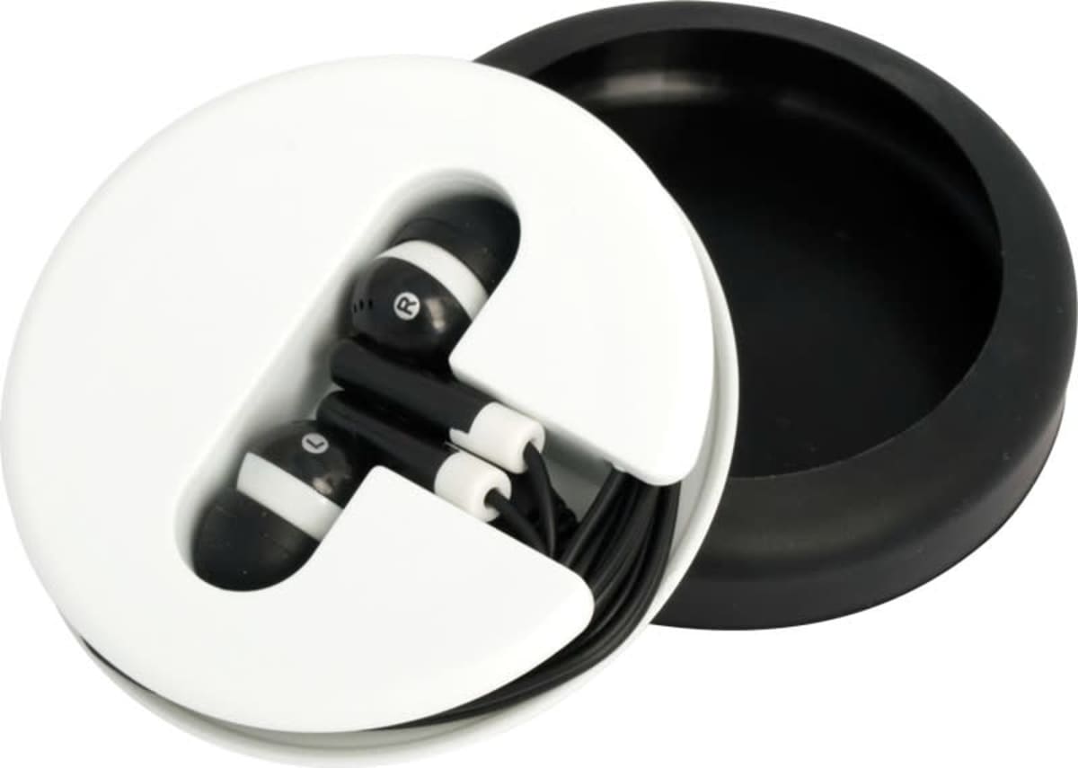 A pair of black and white earphones neatly coiled in a circular white and black case, with the lid partially open, revealing the earphones inside.