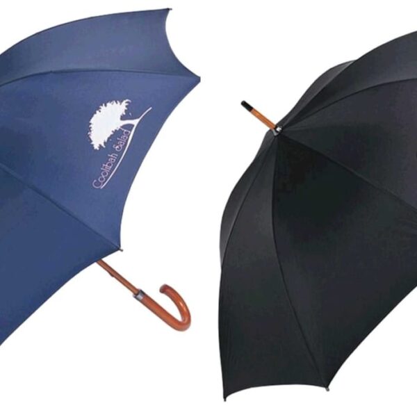 Two open umbrellas with wooden handles. The left umbrella is dark blue with a white logo of a tree and text. The right umbrella is black with a white logo and text in a circular design.