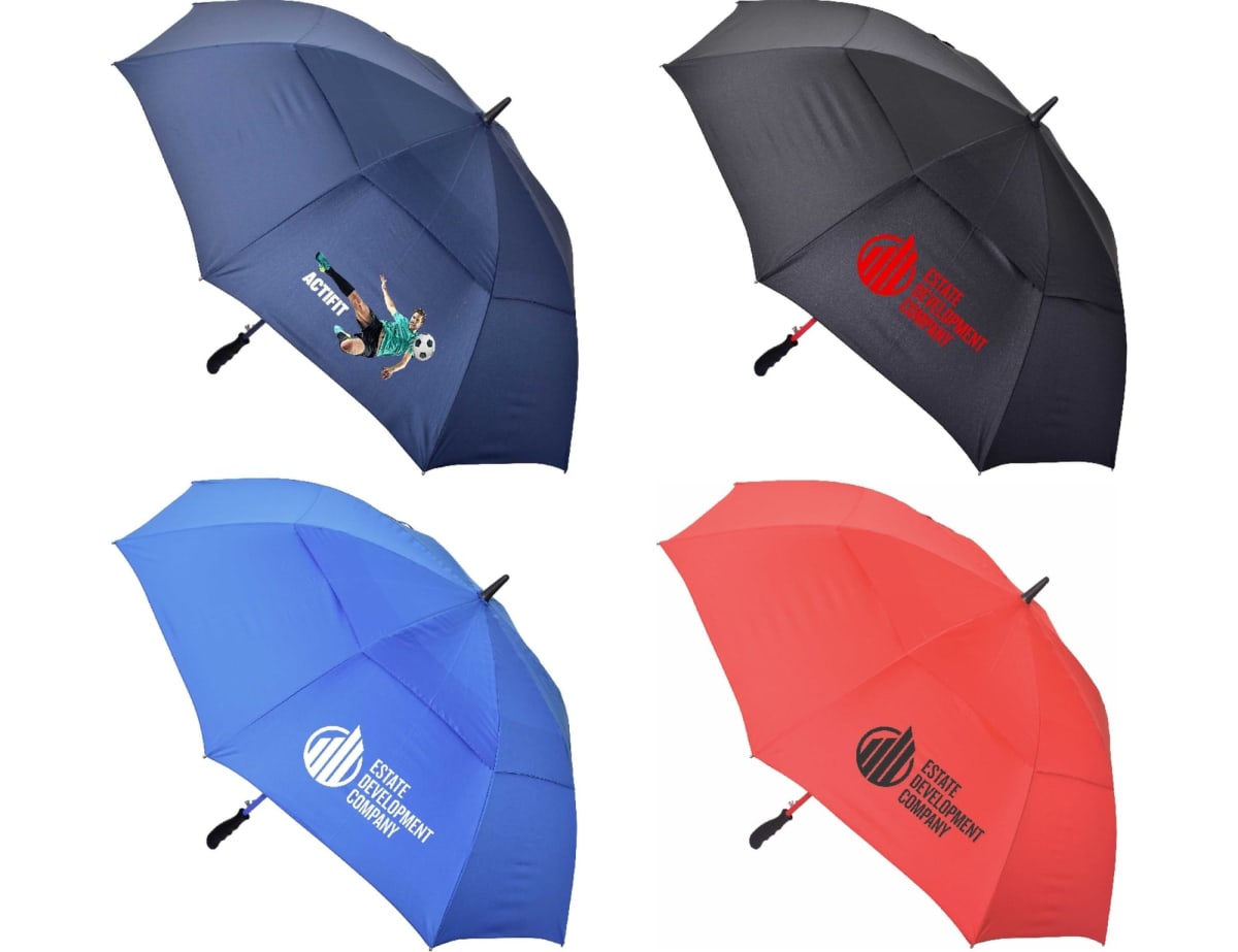 Four umbrellas arranged in a grid: top left is navy with a golfer image, top right is black with a red logo, bottom left is blue with a white logo, and bottom right is red with a black logo.
