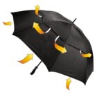 A black umbrella with multiple orange and yellow arrows around it, indicating wind flow or direction. The umbrella is open and the arrows suggest how air moves over and around it.