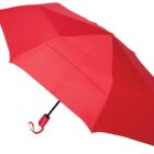 A fully opened red umbrella with a matching red handle and strap, set against a plain white background.