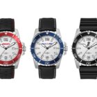 Three wristwatches are displayed side by side: a red-accented Ducati watch with a black leather strap, a blue-accented Scuderia Ferrari watch with a black leather strap, and a black-accented Pirelli watch with a black rubber strap.
