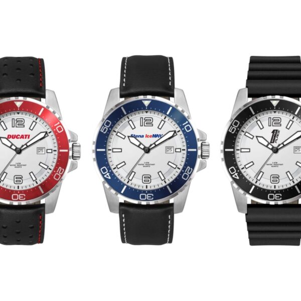 Three wristwatches are displayed side by side: a red-accented Ducati watch with a black leather strap, a blue-accented Scuderia Ferrari watch with a black leather strap, and a black-accented Pirelli watch with a black rubber strap.