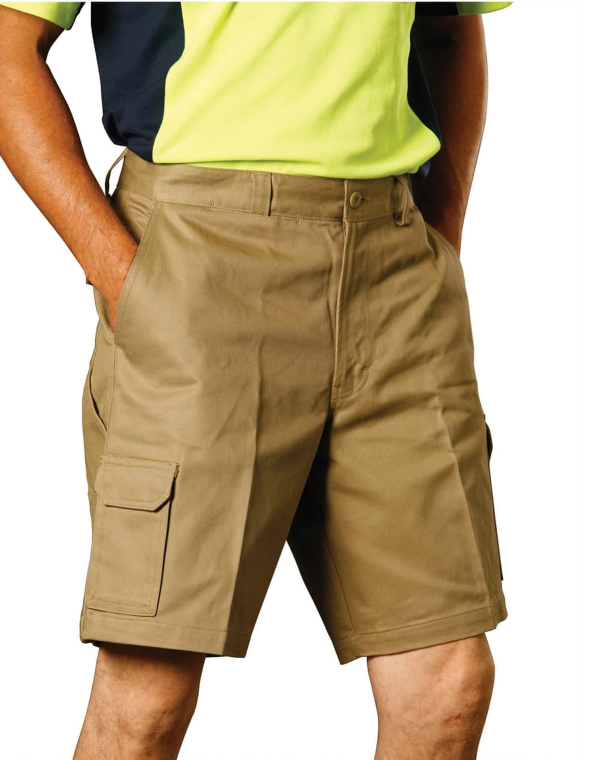 A person wearing a yellow and black shirt is standing with hands in pockets, wearing beige cargo shorts with side pockets against a plain white background.