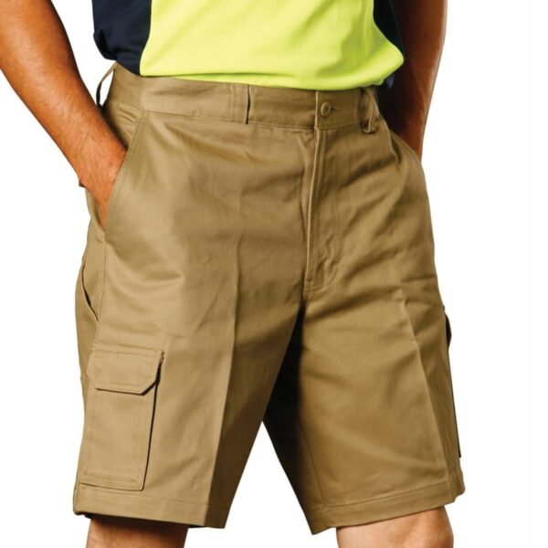 A person wearing tan utility shorts with pockets, paired with a yellow and black shirt. The image focuses on the clothing, showing the shorts design and fit.