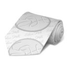A silver-gray necktie featuring an embossed circular monogram with the letters SH and a pattern of the text Silver Hill in a cursive font. The tie is rolled up neatly.
