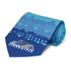 A blue necktie with a pattern of blue buildings. The wider end displays a logo with the text PRIME STATE PROPERTIES and an image of a house roof. The tie is rolled up neatly.