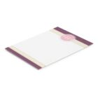 White notepad with purple polka dot edges and a GHS logo.
