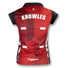 A red and black sports jersey with the name Knowles printed on the back. The jersey features diagonal stripes and four white rectangles. The word Champions is at the bottom. It has short sleeves and a collar.