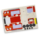 A cardboard cutout sheet featuring parts to assemble a toy fire truck, including red and yellow truck sides, wheels, and various components, arranged flat on a white background.
